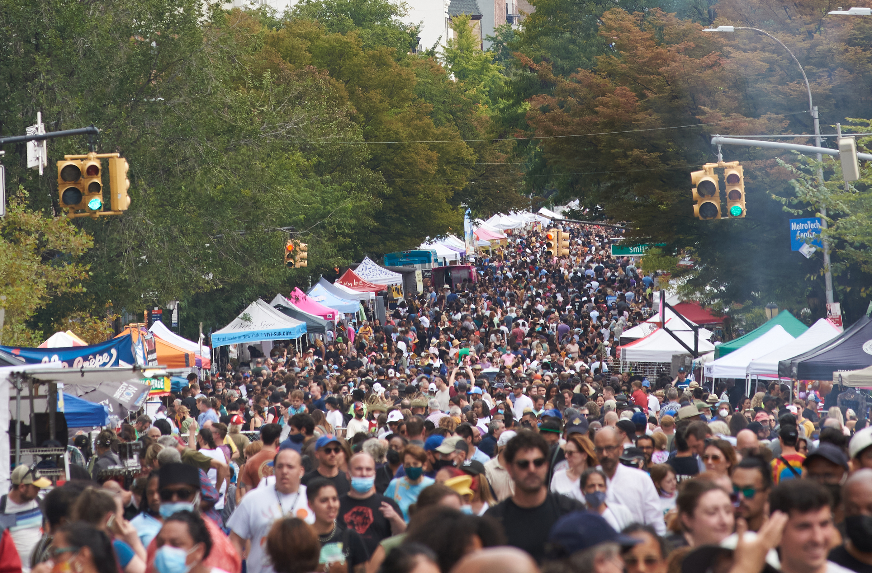 A crowd of people gathered on the street.