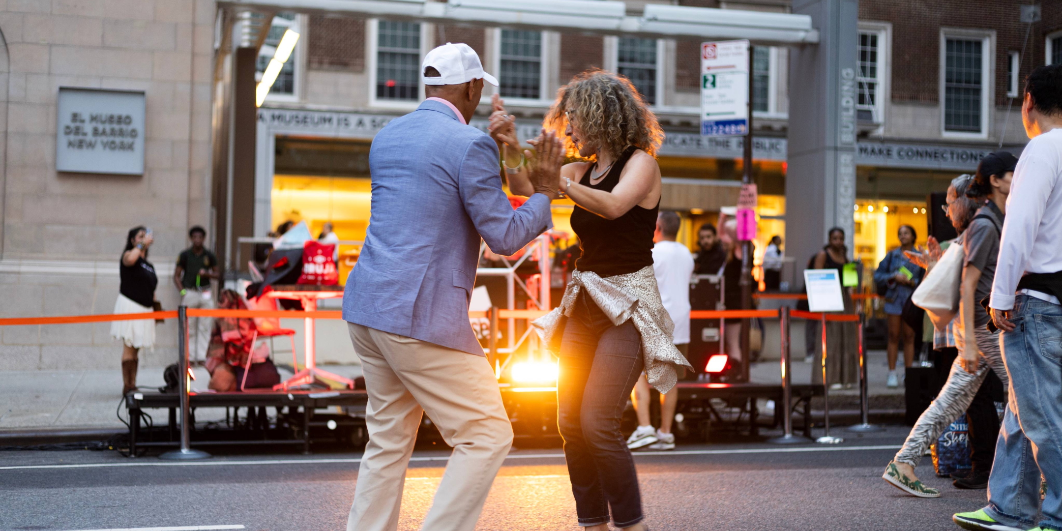 Couple dancing in front of El Museo del Barrio