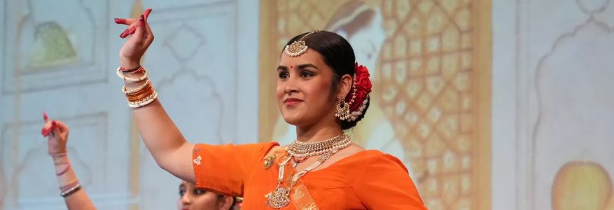 A performer smiling.