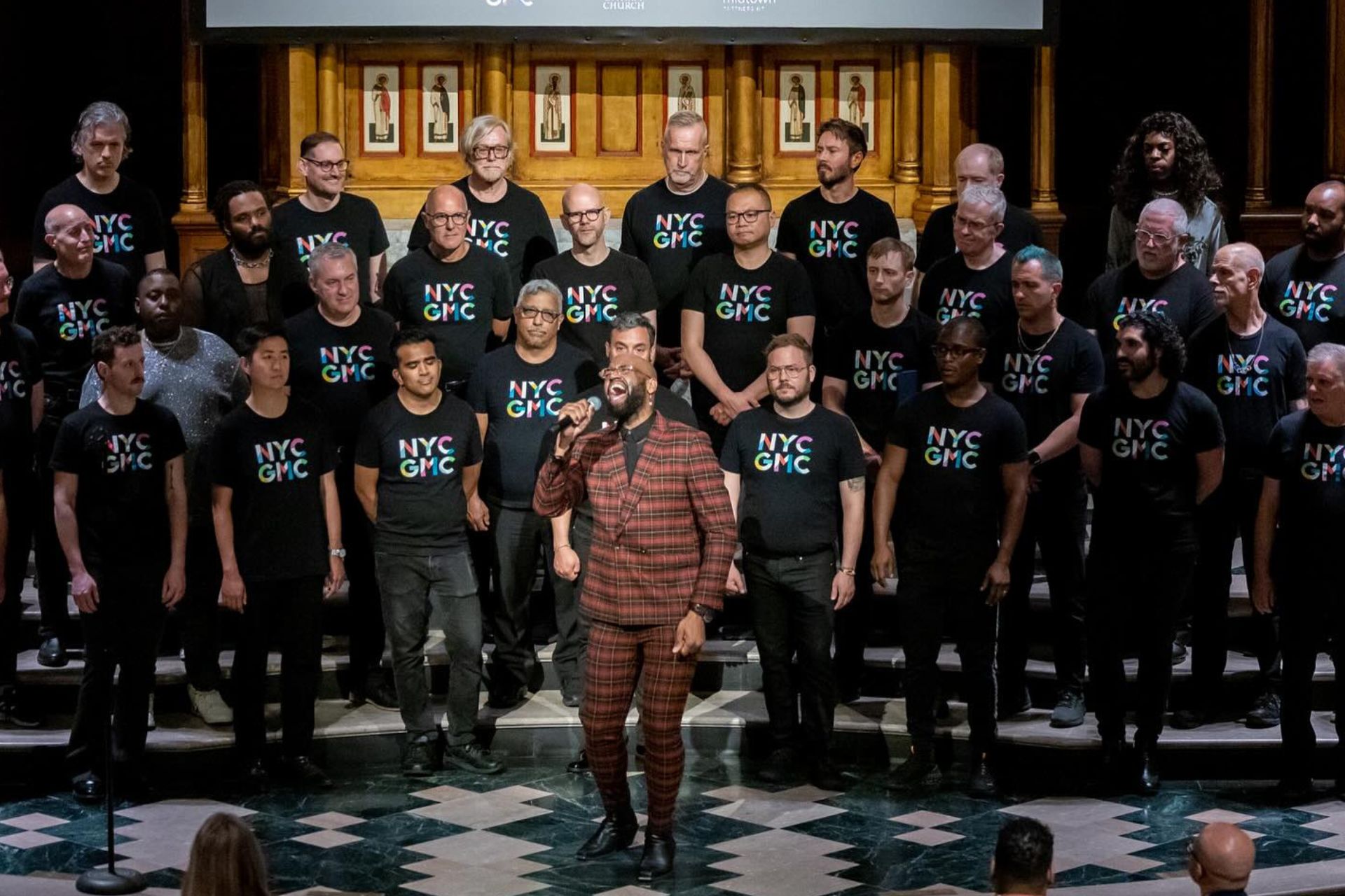 The New York City Gay Men's Chorus stands behind Black & Queer soloist.