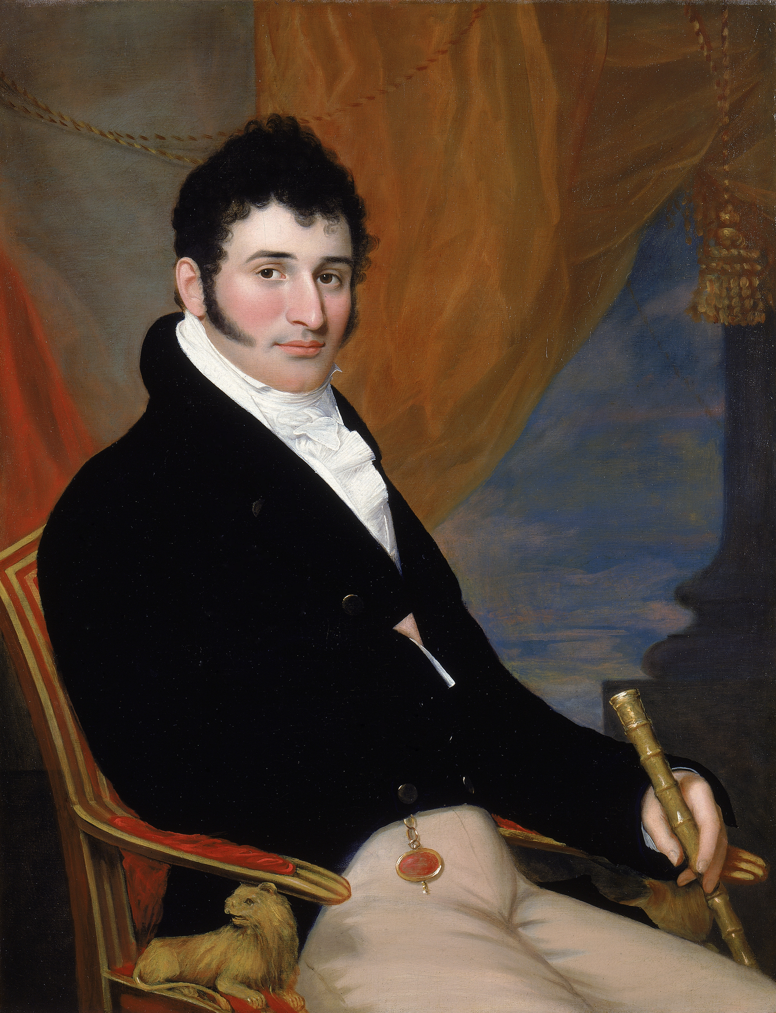 A painting of a young man posed on an extravagant armchair, exuding confidence of a young successful industrialist. The artist provides visual trappings of wealth to define his subject's social standing—a bamboo cane and gold chain on his pocket watch.