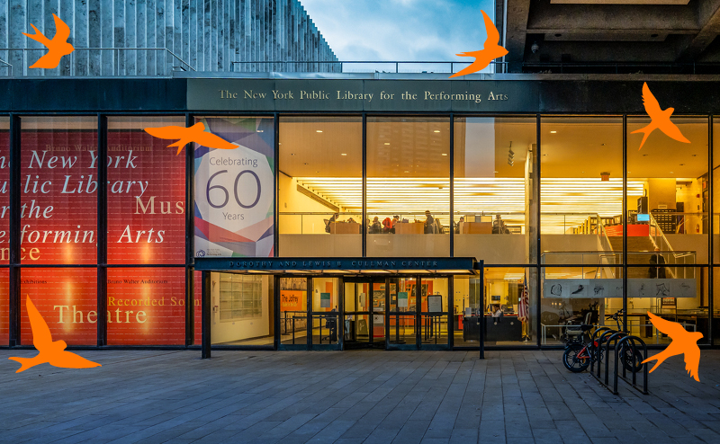 A building with windows as a facade, the sign on the building says the New York Public Library for the Performing Arts