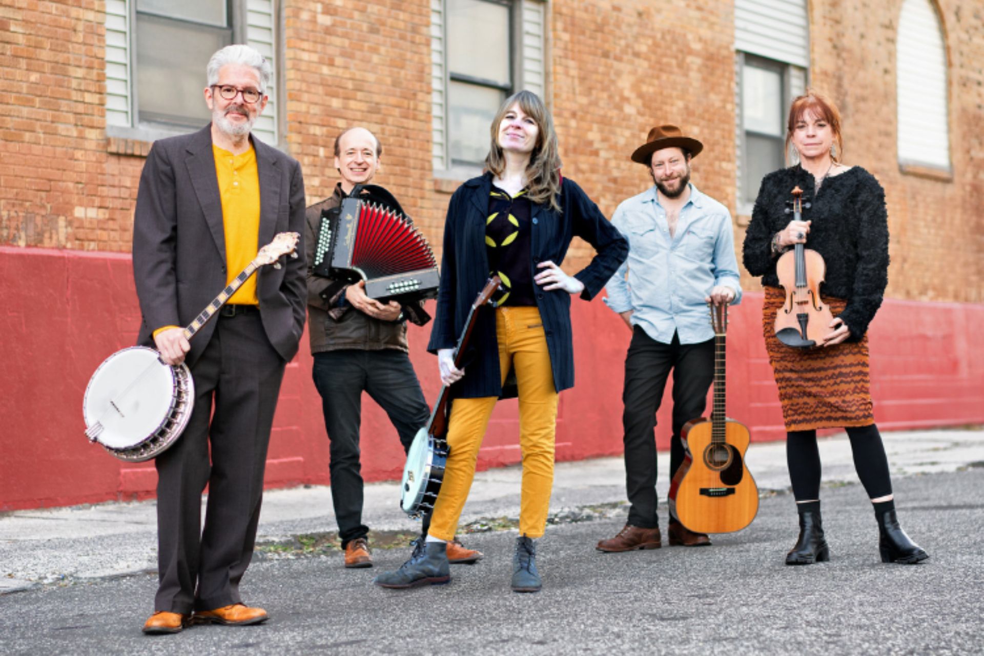 street photo of Irish band Solas with instruments